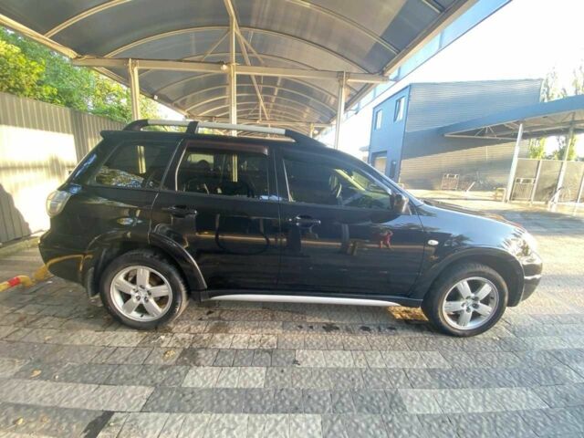 Черный Мицубиси Аутлендер, объемом двигателя 2.4 л и пробегом 219 тыс. км за 6500 $, фото 3 на Automoto.ua