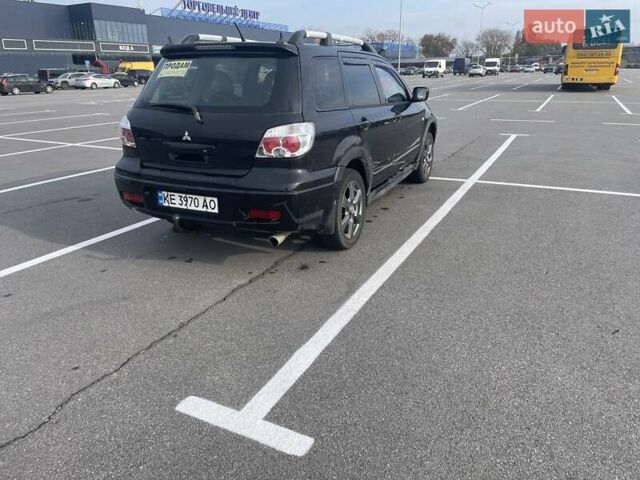 Черный Мицубиси Аутлендер, объемом двигателя 2.38 л и пробегом 180 тыс. км за 6900 $, фото 3 на Automoto.ua