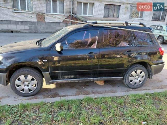 Чорний Міцубісі Аутлендер, об'ємом двигуна 2 л та пробігом 260 тис. км за 5500 $, фото 1 на Automoto.ua