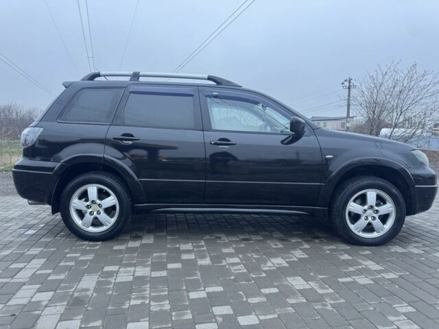 Чорний Міцубісі Аутлендер, об'ємом двигуна 2.4 л та пробігом 202 тис. км за 5800 $, фото 8 на Automoto.ua