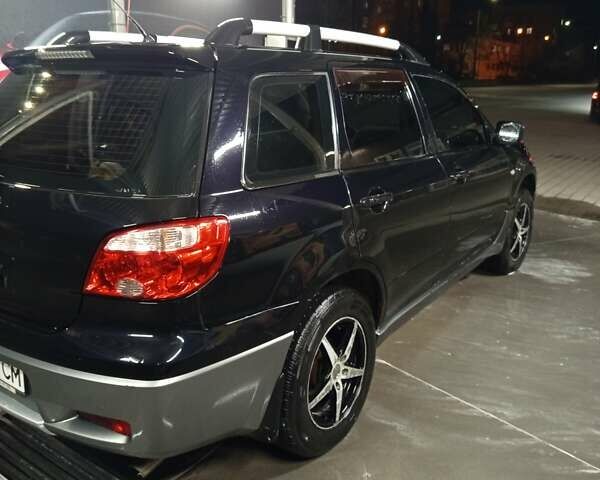 Черный Мицубиси Аутлендер, объемом двигателя 2 л и пробегом 295 тыс. км за 5300 $, фото 6 на Automoto.ua