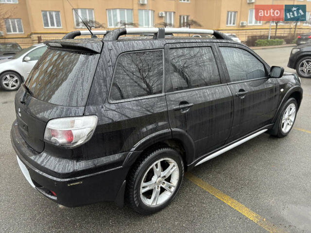 Чорний Міцубісі Аутлендер, об'ємом двигуна 2.4 л та пробігом 169 тис. км за 8000 $, фото 3 на Automoto.ua