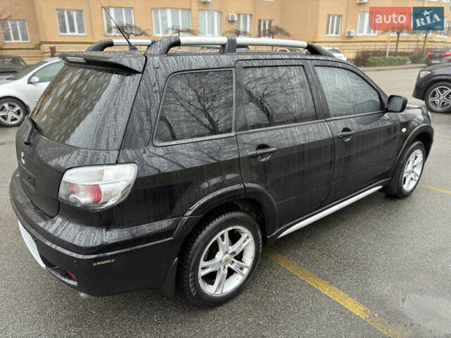 Чорний Міцубісі Аутлендер, об'ємом двигуна 2.4 л та пробігом 169 тис. км за 8000 $, фото 2 на Automoto.ua
