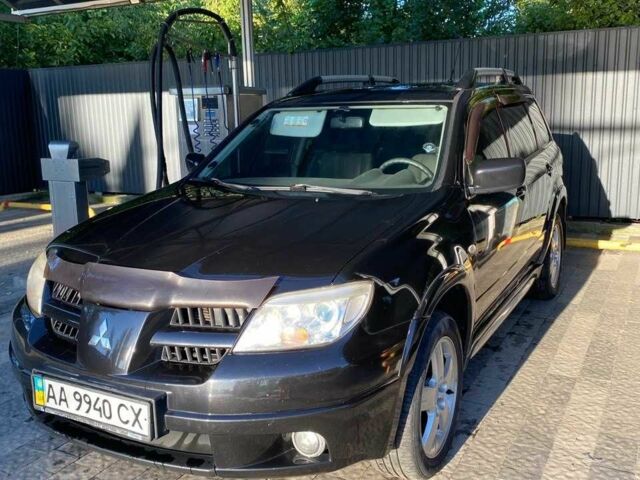 Черный Мицубиси Аутлендер, объемом двигателя 2.4 л и пробегом 219 тыс. км за 6500 $, фото 2 на Automoto.ua