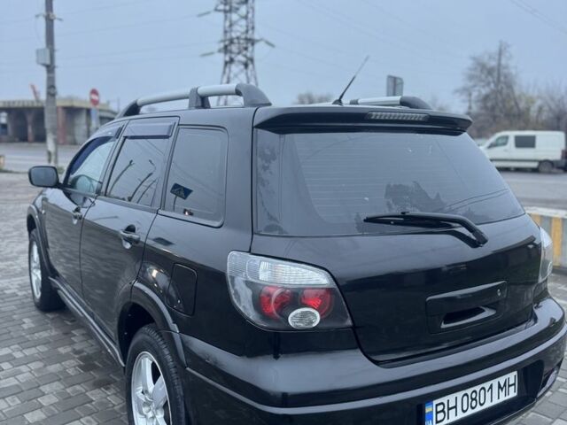 Чорний Міцубісі Аутлендер, об'ємом двигуна 2.4 л та пробігом 202 тис. км за 5800 $, фото 6 на Automoto.ua