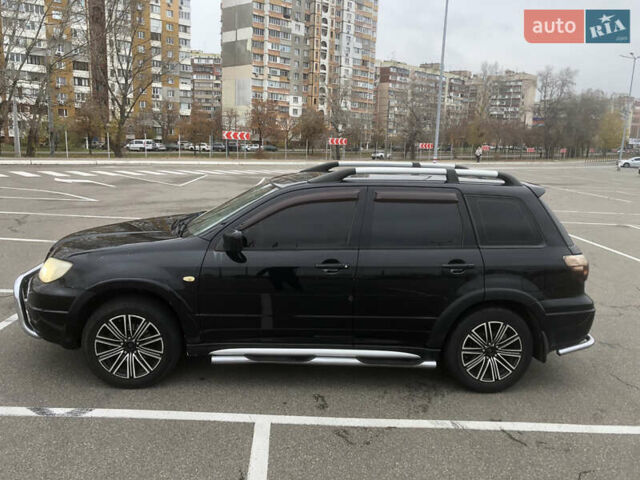 Черный Мицубиси Аутлендер, объемом двигателя 2.38 л и пробегом 314 тыс. км за 5000 $, фото 3 на Automoto.ua