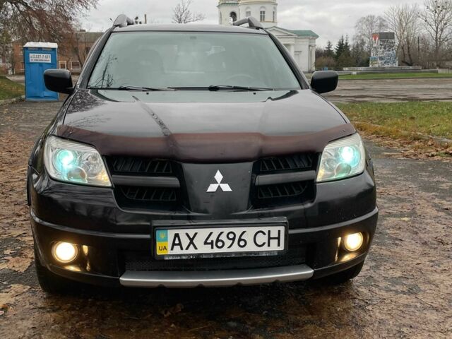 Черный Мицубиси Аутлендер, объемом двигателя 2.4 л и пробегом 213 тыс. км за 6850 $, фото 2 на Automoto.ua