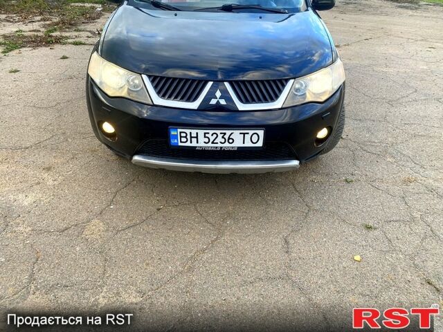 Черный Мицубиси Аутлендер, объемом двигателя 2 л и пробегом 207 тыс. км за 8100 $, фото 1 на Automoto.ua