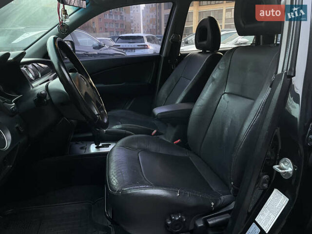 Черный Мицубиси Аутлендер, объемом двигателя 2.4 л и пробегом 248 тыс. км за 7300 $, фото 10 на Automoto.ua
