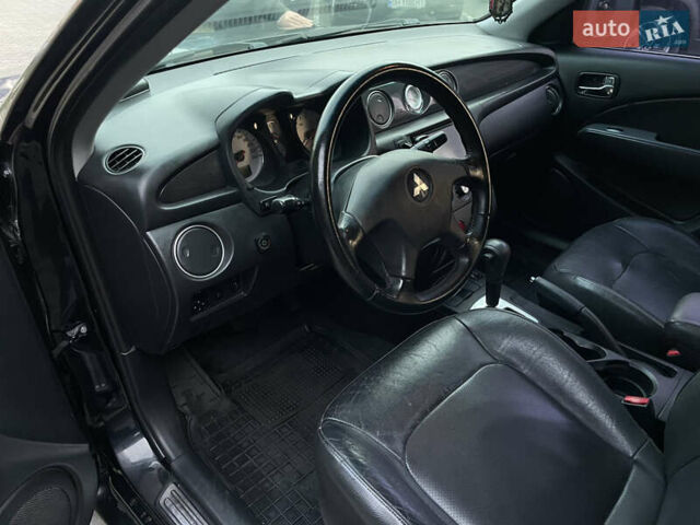 Черный Мицубиси Аутлендер, объемом двигателя 2.4 л и пробегом 248 тыс. км за 7300 $, фото 9 на Automoto.ua