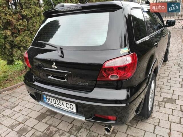 Черный Мицубиси Аутлендер, объемом двигателя 2 л и пробегом 180 тыс. км за 6000 $, фото 5 на Automoto.ua