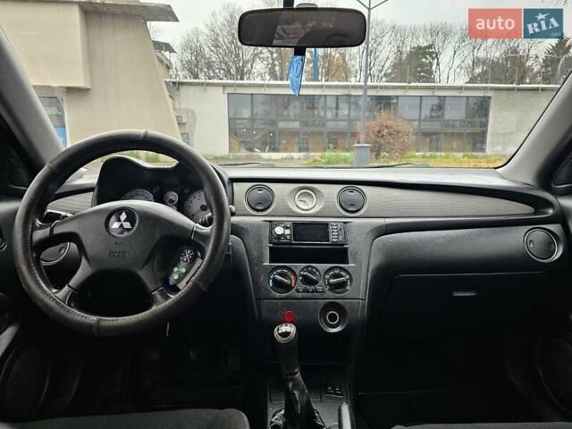 Чорний Міцубісі Аутлендер, об'ємом двигуна 2 л та пробігом 200 тис. км за 4700 $, фото 23 на Automoto.ua