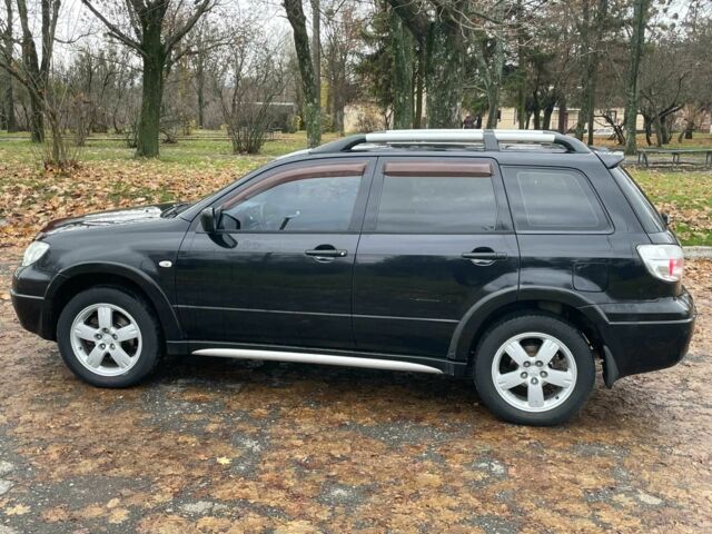 Черный Мицубиси Аутлендер, объемом двигателя 2.4 л и пробегом 213 тыс. км за 6850 $, фото 6 на Automoto.ua