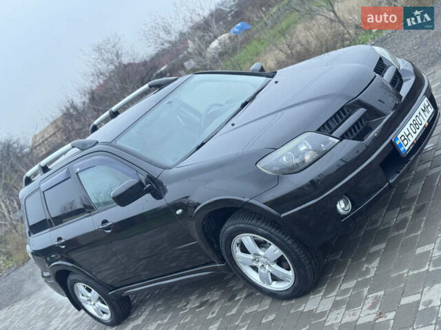 Чорний Міцубісі Аутлендер, об'ємом двигуна 2.38 л та пробігом 202 тис. км за 5800 $, фото 4 на Automoto.ua