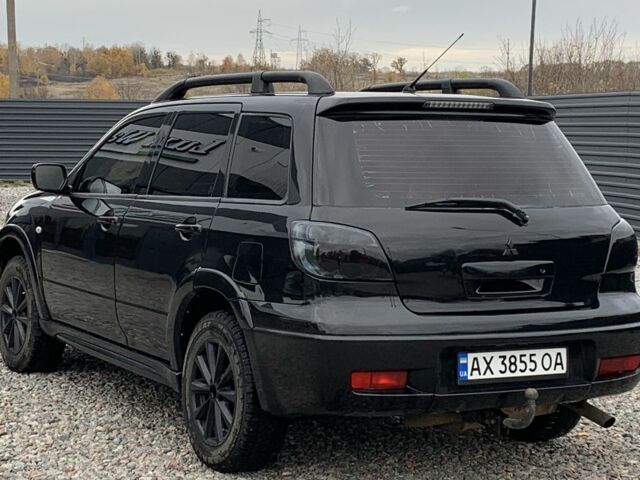 Міцубісі Аутлендер 2007 у Харкові на Automoto.ua Чорний Міцубісі Аутлендер, об'ємом двигуна 2.4 л та пробігом 240 тис. км за 5600 $, фото 7 на Automoto.ua