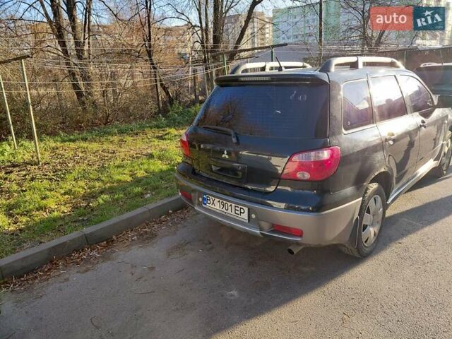 Чорний Міцубісі Аутлендер, об'ємом двигуна 2 л та пробігом 260 тис. км за 5500 $, фото 3 на Automoto.ua