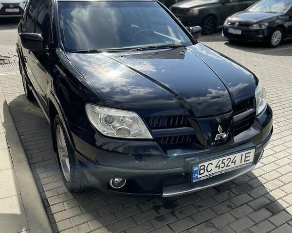 Черный Мицубиси Аутлендер, объемом двигателя 2.38 л и пробегом 310 тыс. км за 7500 $, фото 20 на Automoto.ua