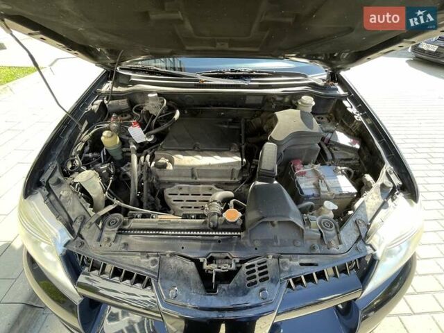 Черный Мицубиси Аутлендер, объемом двигателя 2.38 л и пробегом 310 тыс. км за 7500 $, фото 3 на Automoto.ua