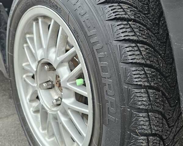 Чорний Міцубісі Аутлендер, об'ємом двигуна 2 л та пробігом 200 тис. км за 4700 $, фото 18 на Automoto.ua