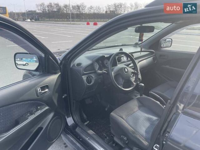 Черный Мицубиси Аутлендер, объемом двигателя 2.38 л и пробегом 180 тыс. км за 6900 $, фото 4 на Automoto.ua