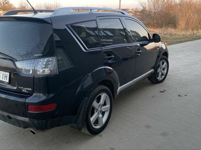 Чорний Міцубісі Аутлендер, об'ємом двигуна 2.4 л та пробігом 200 тис. км за 8300 $, фото 2 на Automoto.ua