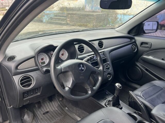 Чорний Міцубісі Аутлендер, об'ємом двигуна 2 л та пробігом 220 тис. км за 6299 $, фото 18 на Automoto.ua