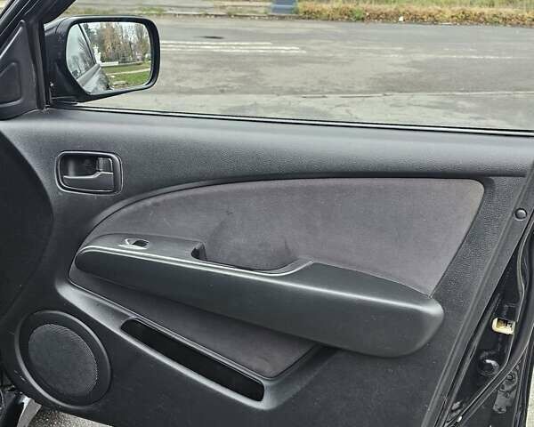 Чорний Міцубісі Аутлендер, об'ємом двигуна 2 л та пробігом 290 тис. км за 5000 $, фото 17 на Automoto.ua