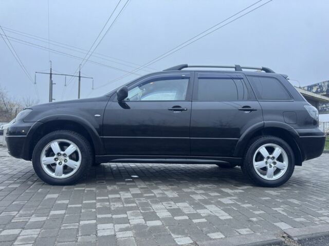 Чорний Міцубісі Аутлендер, об'ємом двигуна 2.4 л та пробігом 202 тис. км за 5800 $, фото 4 на Automoto.ua