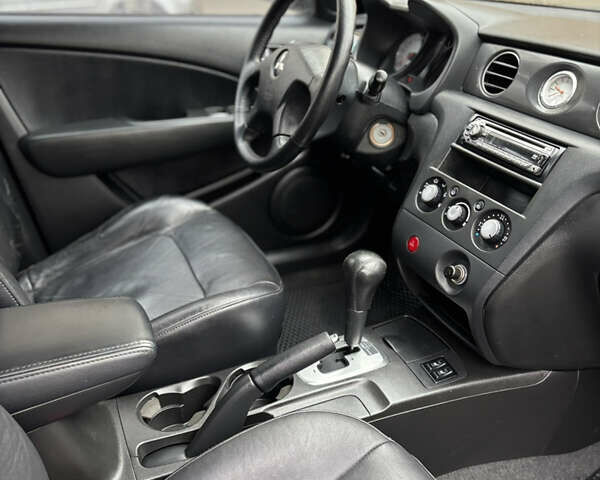 Чорний Міцубісі Аутлендер, об'ємом двигуна 2.4 л та пробігом 169 тис. км за 8000 $, фото 6 на Automoto.ua