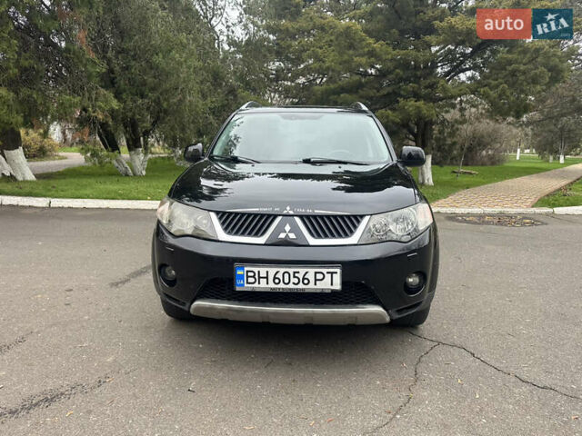Чорний Міцубісі Аутлендер, об'ємом двигуна 2.4 л та пробігом 230 тис. км за 8300 $, фото 1 на Automoto.ua