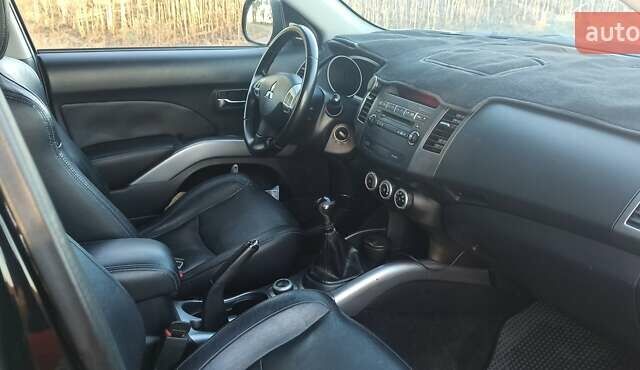 Черный Мицубиси Аутлендер, объемом двигателя 1.97 л и пробегом 244 тыс. км за 9000 $, фото 25 на Automoto.ua