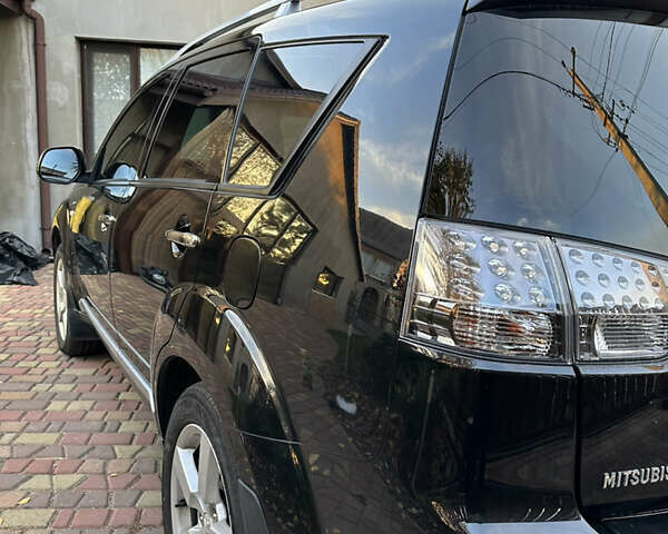 Чорний Міцубісі Аутлендер, об'ємом двигуна 3 л та пробігом 238 тис. км за 11200 $, фото 7 на Automoto.ua