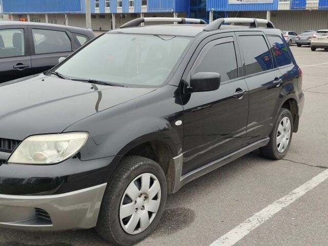 Чорний Міцубісі Аутлендер, об'ємом двигуна 2 л та пробігом 175 тис. км за 7800 $, фото 1 на Automoto.ua