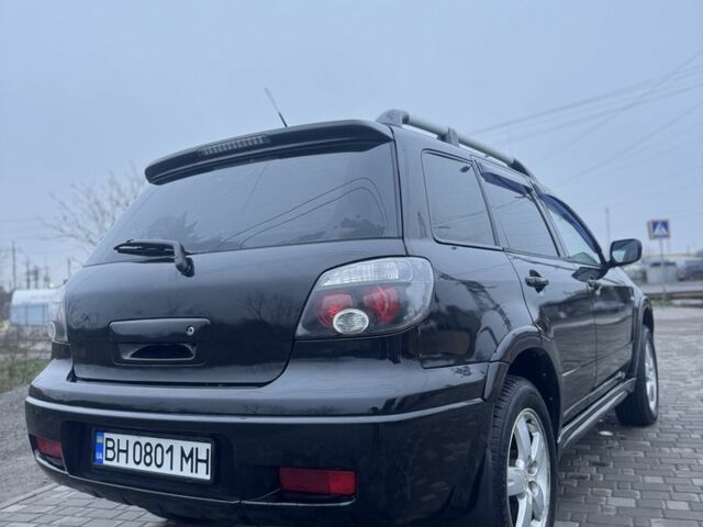 Чорний Міцубісі Аутлендер, об'ємом двигуна 2.4 л та пробігом 202 тис. км за 5800 $, фото 7 на Automoto.ua
