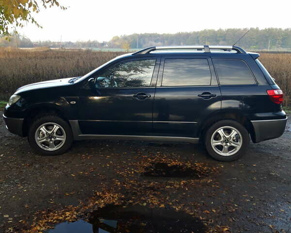 Мицубиси Аутлендер 2007 в Мироновке на Automoto.ua Черный Мицубиси Аутлендер, объемом двигателя 2 л и пробегом 278 тыс. км за 6500 $, фото 4 на Automoto.ua