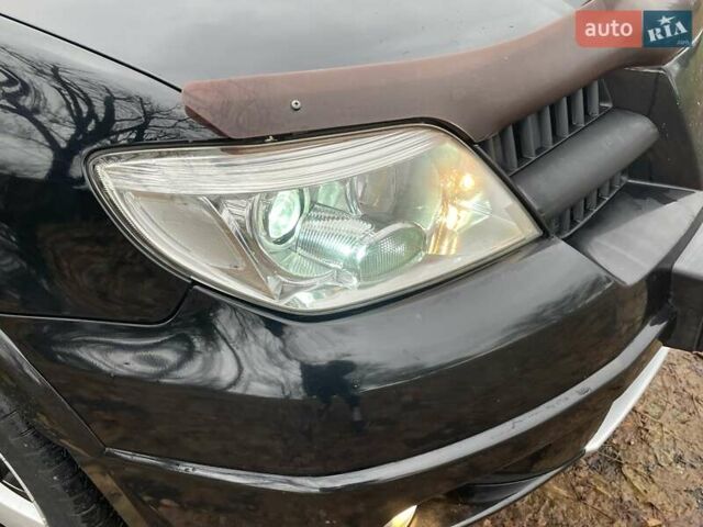 Чорний Міцубісі Аутлендер, об'ємом двигуна 2.4 л та пробігом 213 тис. км за 6850 $, фото 12 на Automoto.ua