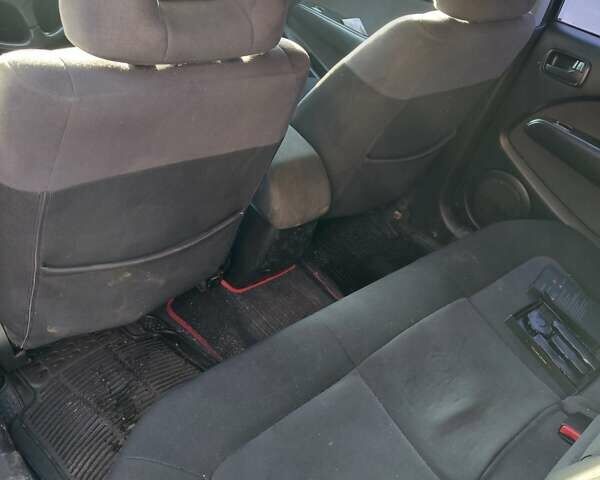 Чорний Міцубісі Аутлендер, об'ємом двигуна 2 л та пробігом 260 тис. км за 5500 $, фото 5 на Automoto.ua