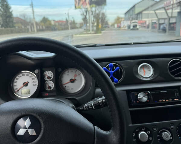 Чорний Міцубісі Аутлендер, об'ємом двигуна 2 л та пробігом 280 тис. км за 7500 $, фото 8 на Automoto.ua