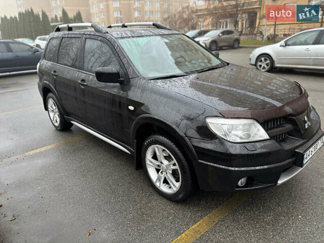 Чорний Міцубісі Аутлендер, об'ємом двигуна 2.4 л та пробігом 169 тис. км за 8000 $, фото 4 на Automoto.ua
