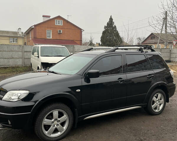 Чорний Міцубісі Аутлендер, об'ємом двигуна 2 л та пробігом 172 тис. км за 7500 $, фото 1 на Automoto.ua