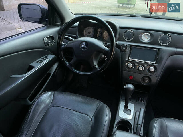 Черный Мицубиси Аутлендер, объемом двигателя 2.4 л и пробегом 248 тыс. км за 7300 $, фото 16 на Automoto.ua