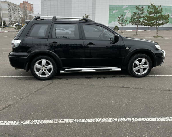 Чорний Міцубісі Аутлендер, об'ємом двигуна 2.38 л та пробігом 198 тис. км за 7100 $, фото 2 на Automoto.ua