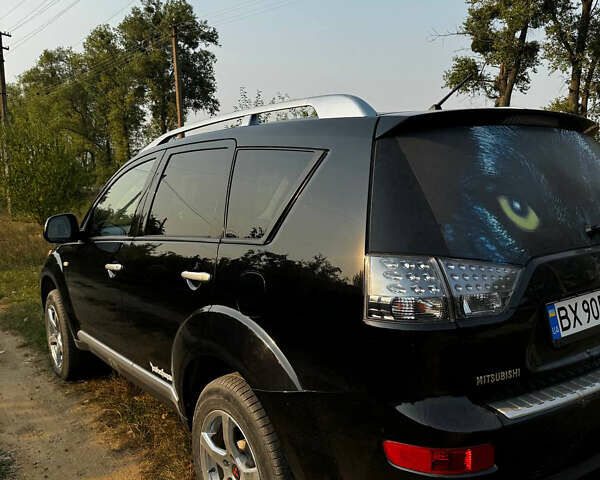 Черный Мицубиси Аутлендер, объемом двигателя 2 л и пробегом 200 тыс. км за 7700 $, фото 4 на Automoto.ua