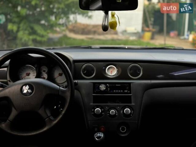 Чорний Міцубісі Аутлендер, об'ємом двигуна 2 л та пробігом 280 тис. км за 7500 $, фото 10 на Automoto.ua