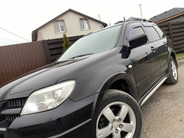 Черный Мицубиси Аутлендер, объемом двигателя 2.4 л и пробегом 178 тыс. км за 6900 $, фото 13 на Automoto.ua