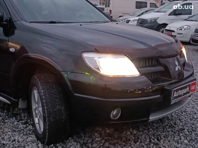 Черный Мицубиси Аутлендер, объемом двигателя 2 л и пробегом 271 тыс. км за 6940 $, фото 12 на Automoto.ua
