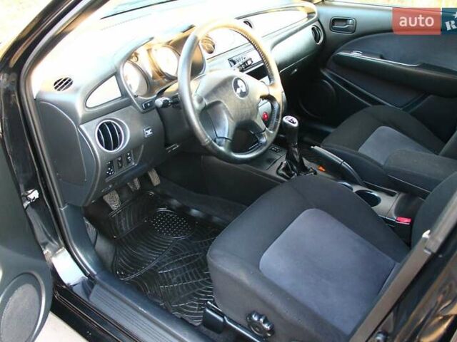 Черный Мицубиси Аутлендер, объемом двигателя 2 л и пробегом 190 тыс. км за 6900 $, фото 41 на Automoto.ua