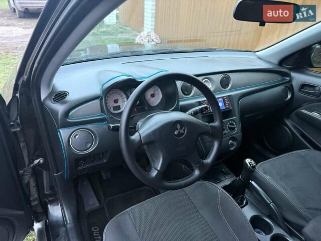 Черный Мицубиси Аутлендер, объемом двигателя 2 л и пробегом 232 тыс. км за 7000 $, фото 12 на Automoto.ua