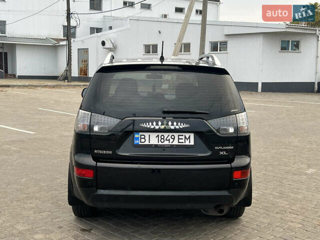 Черный Мицубиси Аутлендер, объемом двигателя 2.4 л и пробегом 230 тыс. км за 6650 $, фото 11 на Automoto.ua