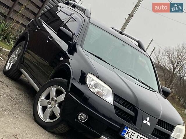 Черный Мицубиси Аутлендер, объемом двигателя 2.4 л и пробегом 178 тыс. км за 6900 $, фото 2 на Automoto.ua